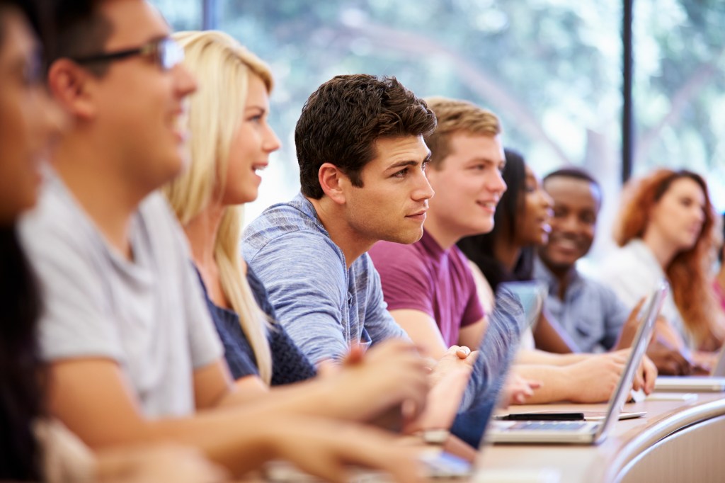 Class Of University Students Using Laptops In Lecture, free image from unidentified online source